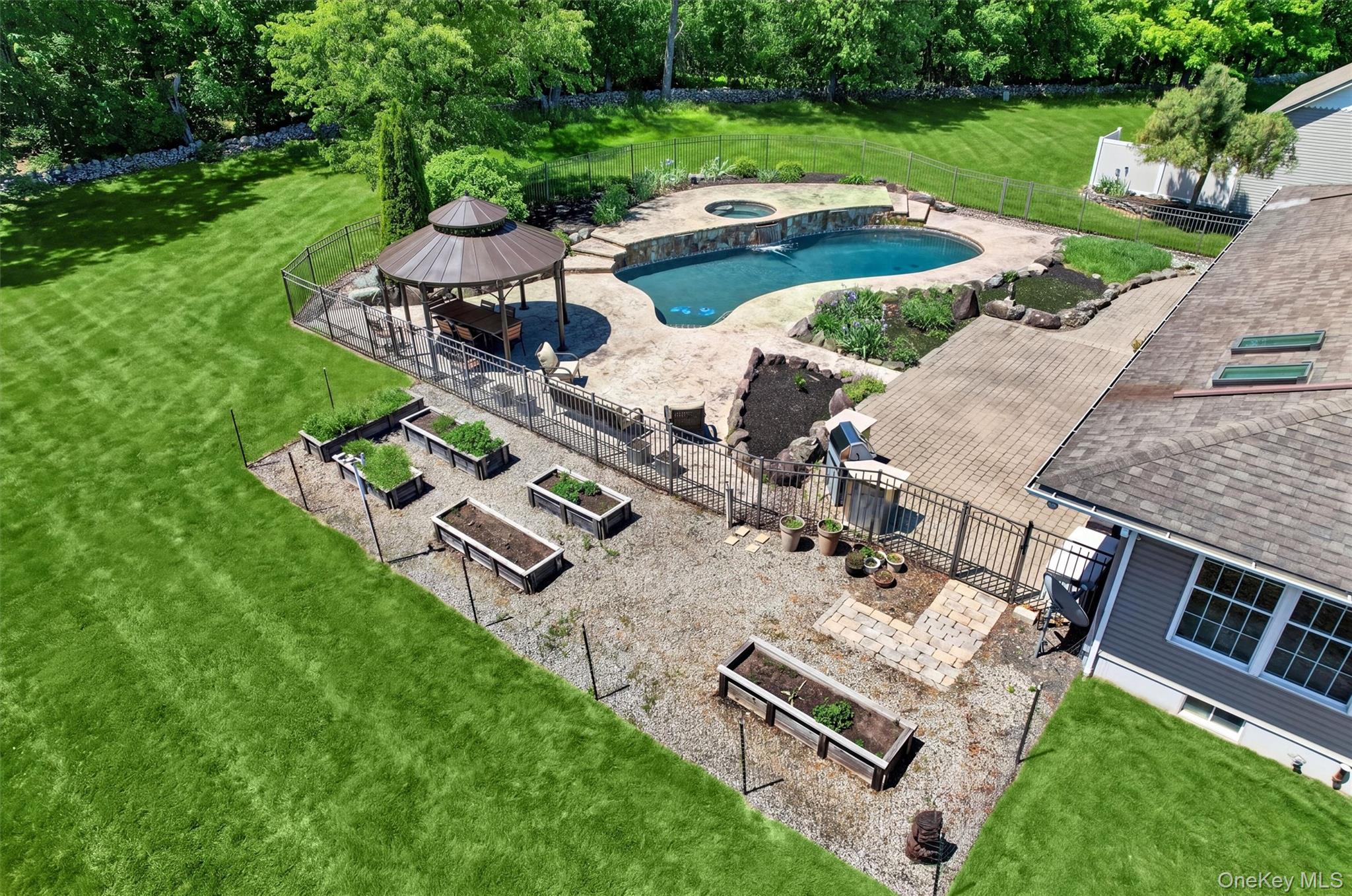 954 Ridgebury Road New Hampton, NY 10958 - Photo 40 of 45 From above, the backyard feels like its own private retreat, with space for gardening, relaxing by the pool, and enjoying long summer days outdoors.