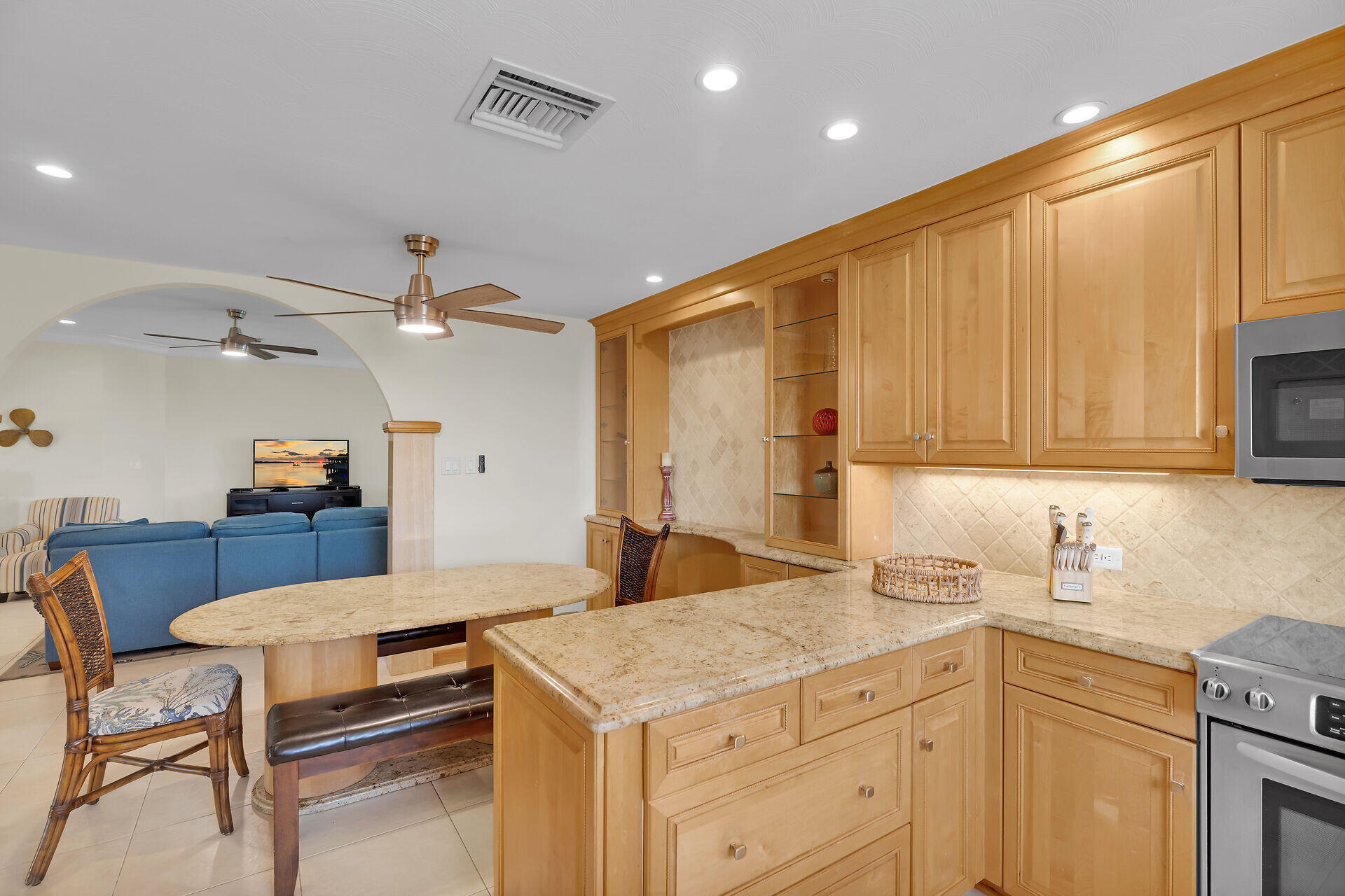 580-590 10th Street Key Colony Beach, FL 33051 - Photo 18 of 75 a kitchen with a stove a sink cabinets and wooden floor