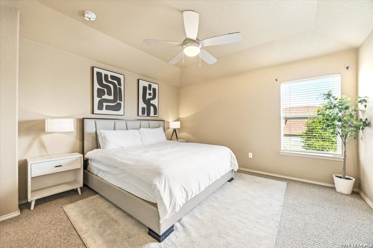 3831 Bacall Way Converse, TX 78109 - Photo 18 of 33 a bedroom with a bed and a window