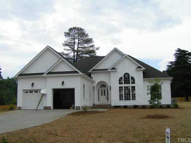 2438 Rolling Tracks Road Willow Spring, NC 27592 - Photo 1 of 8 a view of a house with a yard