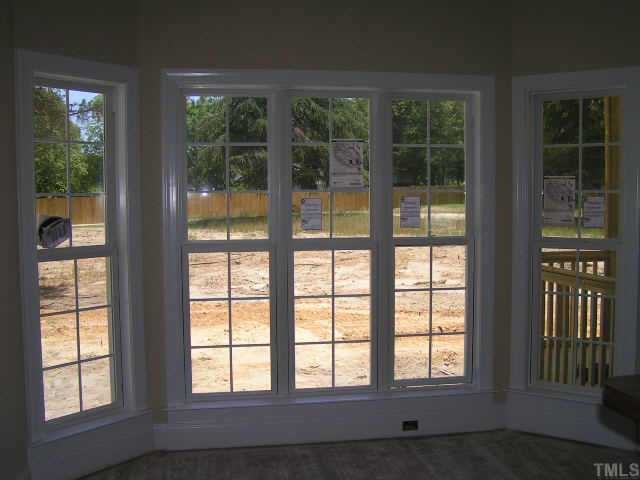 2438 Rolling Tracks Road Willow Spring, NC 27592 - Photo 4 of 8 a view of an empty room with a large window