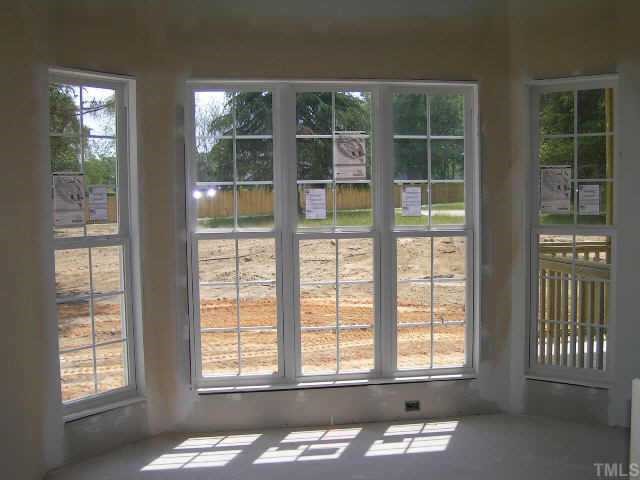 2438 Rolling Tracks Road Willow Spring, NC 27592 - Photo 5 of 8 a front view of a house with a large window