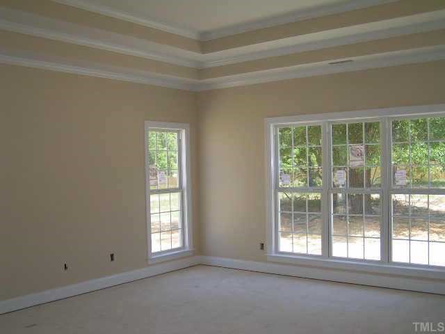 2438 Rolling Tracks Road Willow Spring, NC 27592 - Photo 6 of 8 a view of empty room with window