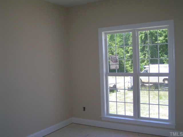 2438 Rolling Tracks Road Willow Spring, NC 27592 - Photo 7 of 8 a small space with a window