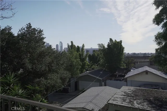 a kitchen with stainless steel appliances granite countertop a refrigerator a stove a sink and dishwasher