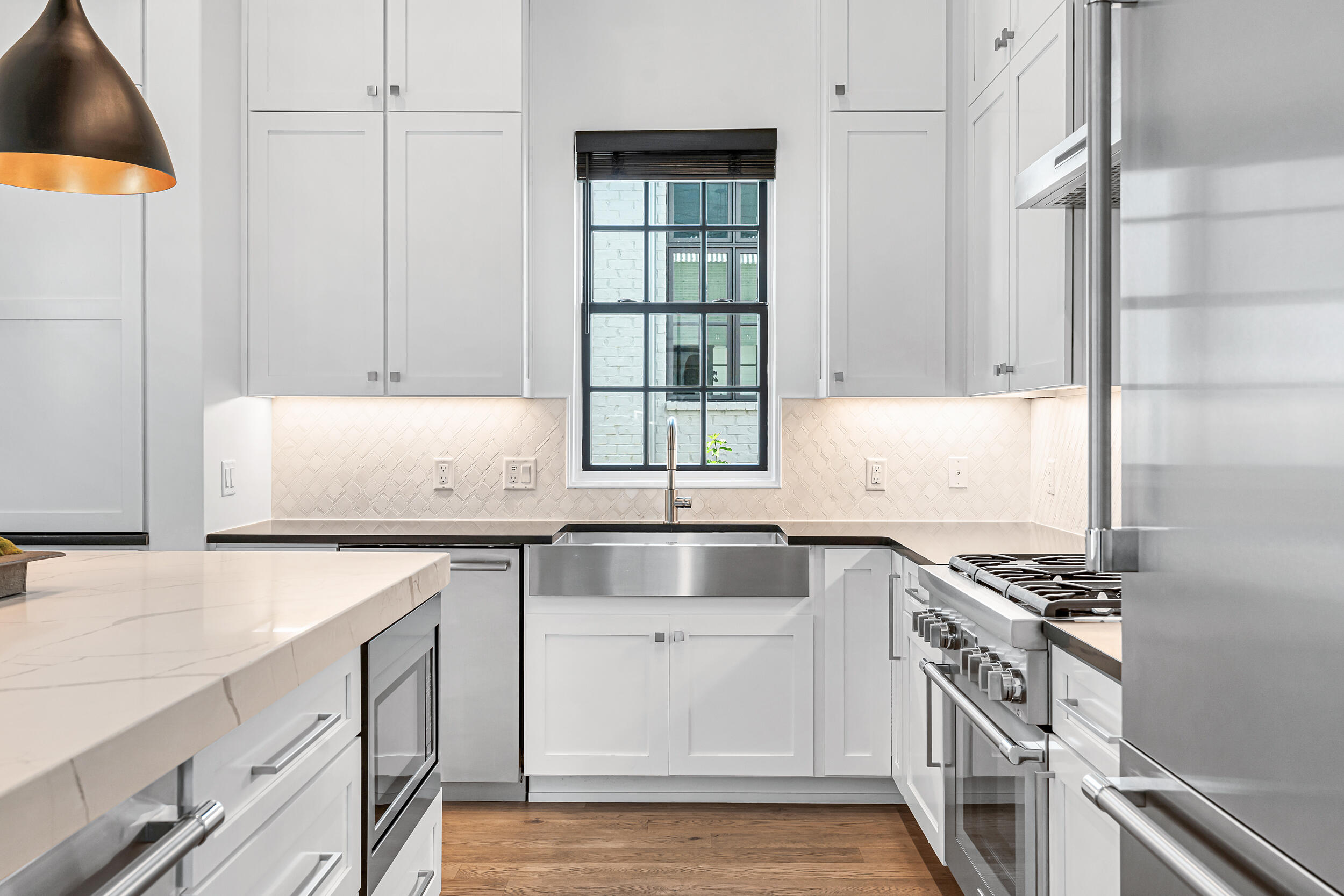 95 Tyler Santa Rosa Beach, FL 32459 - Photo 17 of 58 a kitchen with granite countertop a sink stove and cabinets