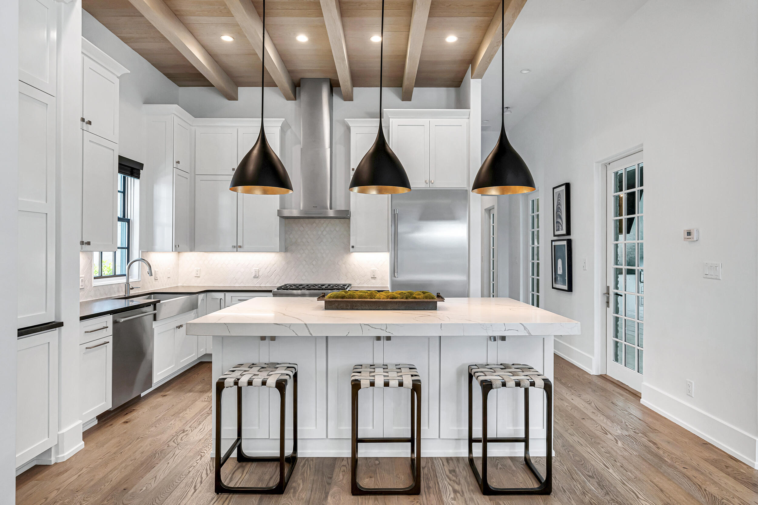 95 Tyler Santa Rosa Beach, FL 32459 - Photo 19 of 58 a kitchen with stainless steel appliances kitchen island a chandelier and wooden cabinets