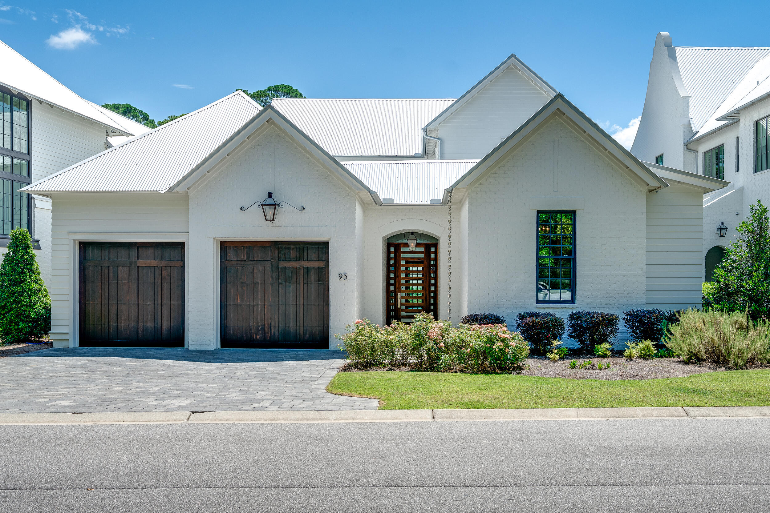 95 Tyler Santa Rosa Beach, FL 32459 - Photo 2 of 58 a front view of a house with a yard and garage