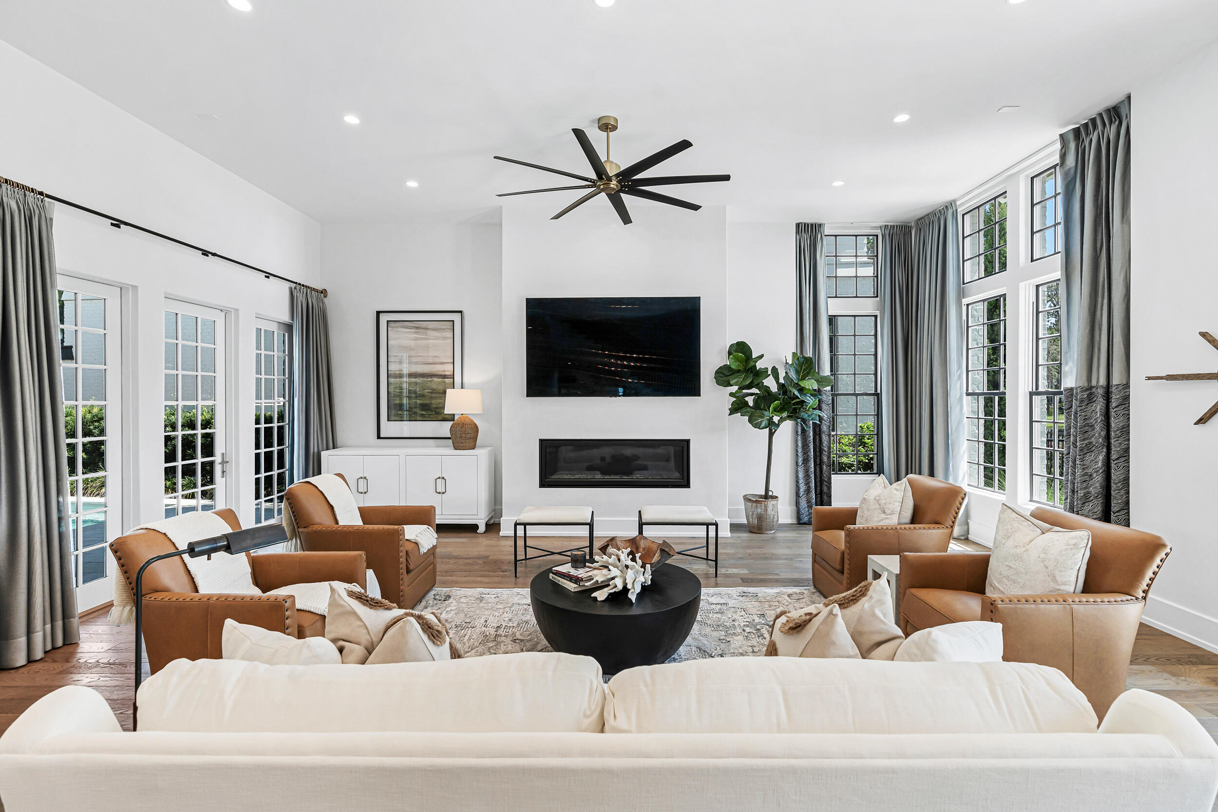95 Tyler Santa Rosa Beach, FL 32459 - Photo 23 of 58 a living room with furniture a fireplace and a potted plant