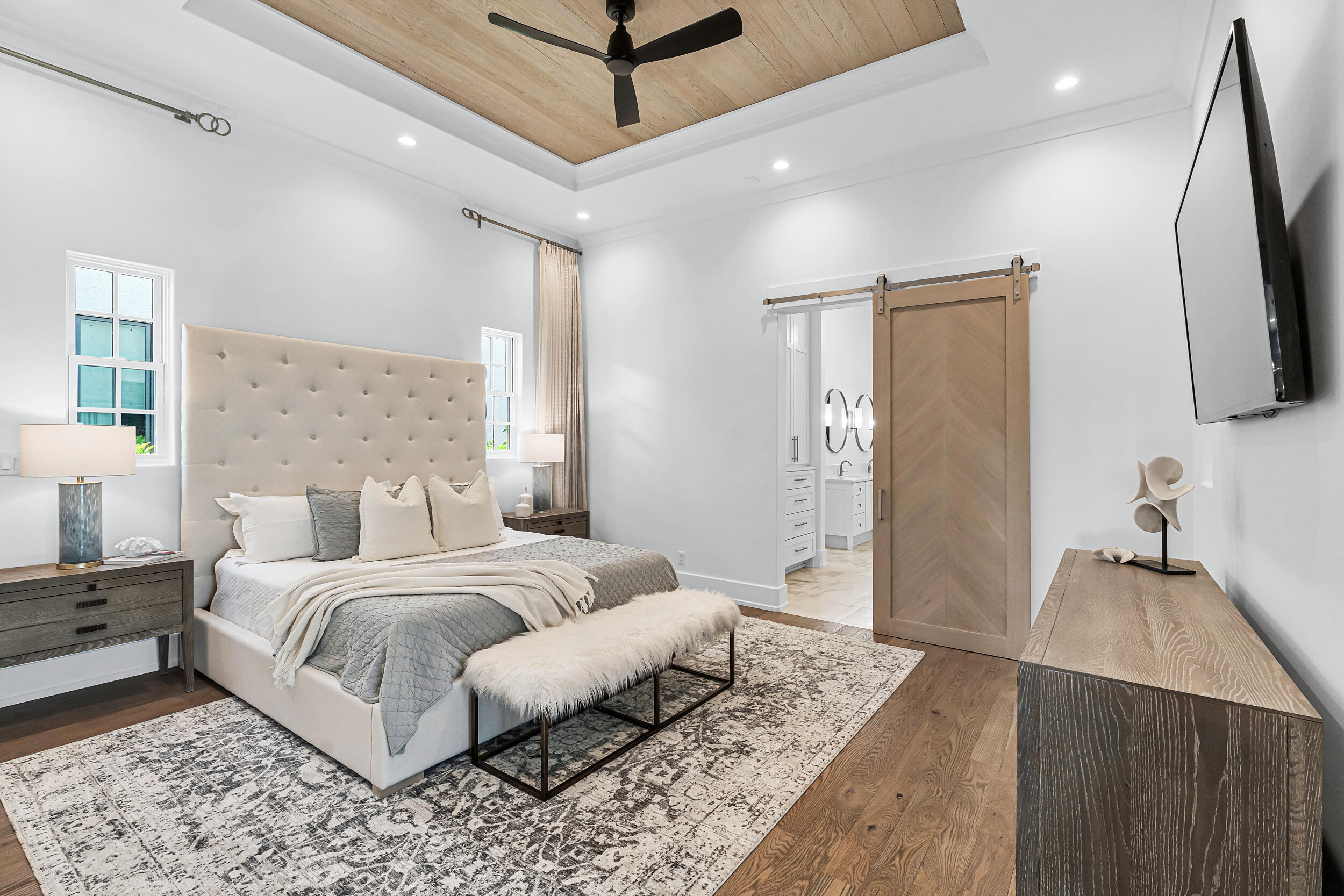 95 Tyler Santa Rosa Beach, FL 32459 - Photo 25 of 58 a bedroom with a bed flat screen tv and a couch