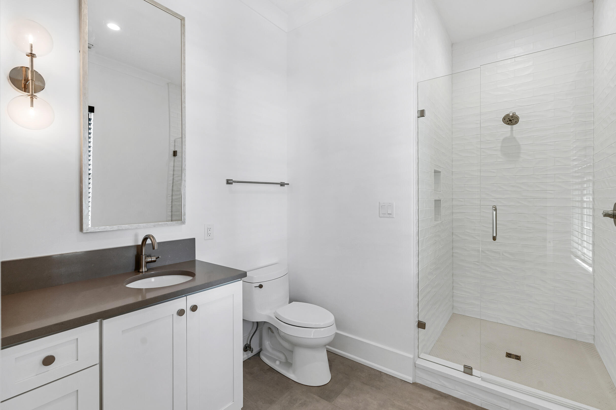 95 Tyler Santa Rosa Beach, FL 32459 - Photo 35 of 58 a bathroom with a granite countertop sink a toilet and a mirror