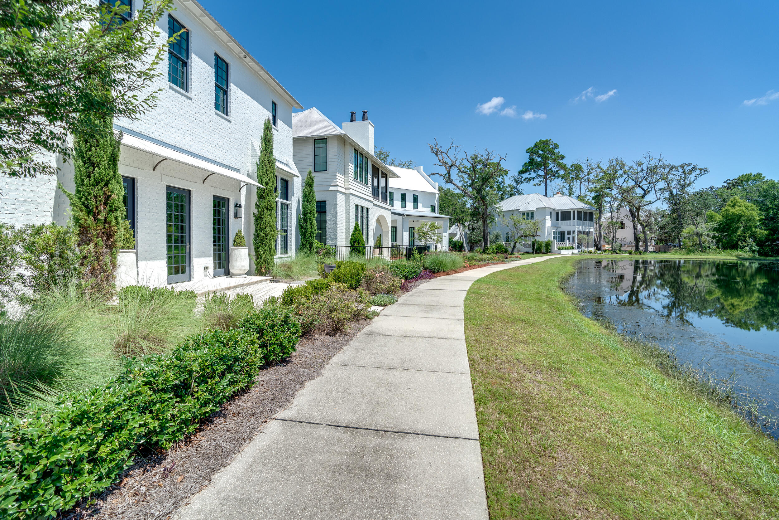 95 Tyler Santa Rosa Beach, FL 32459 - Photo 45 of 58 a front view of a house with a yard and trees