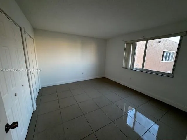 a view of an empty room and entryway