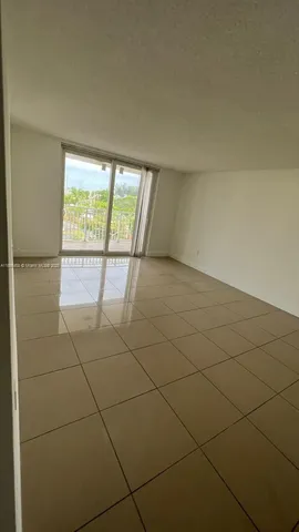 a view of a livingroom and window