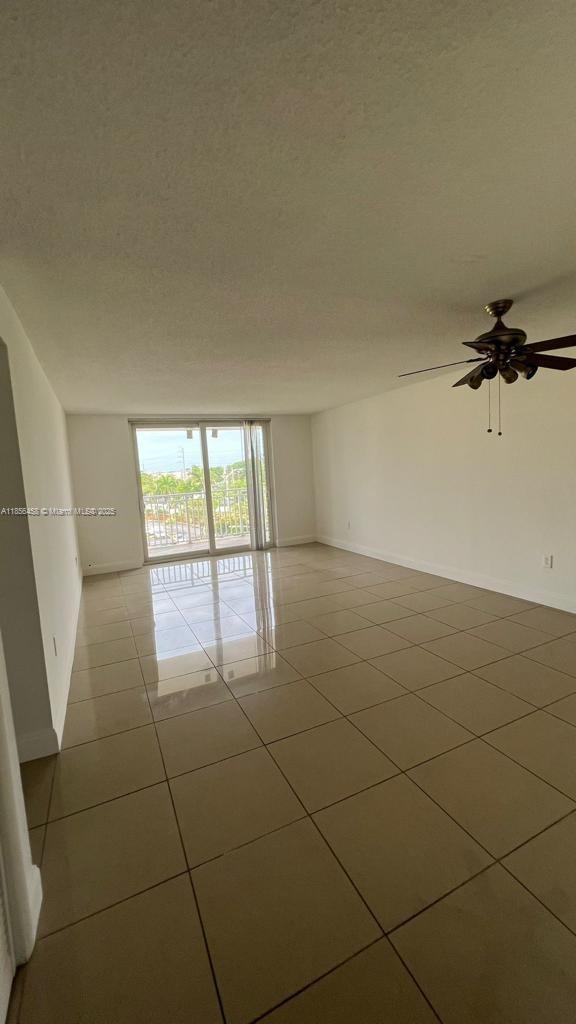 6950 Miami Gardens Drive, Unit 2508 Hialeah, FL 33015 - Photo 20 of 27 a view of a livingroom and window