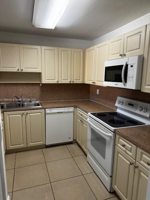 6950 Miami Gardens Drive, Unit 2508 Hialeah, FL 33015 - Photo 2 of 27 a kitchen with cabinets stainless steel appliances and sink