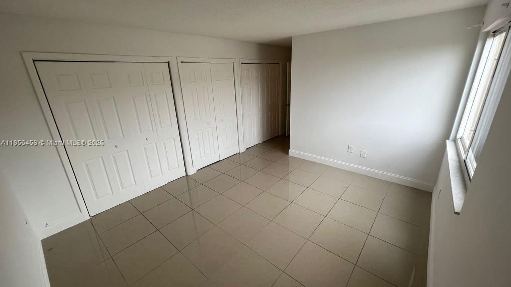 6950 Miami Gardens Drive, Unit 2508 Hialeah, FL 33015 - Photo 21 of 27 a view of an empty room