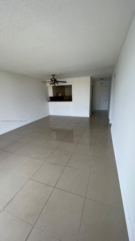 6950 Miami Gardens Drive, Unit 2508 Hialeah, FL 33015 - Photo 22 of 27 a view of a livingroom with an empty space and a sink