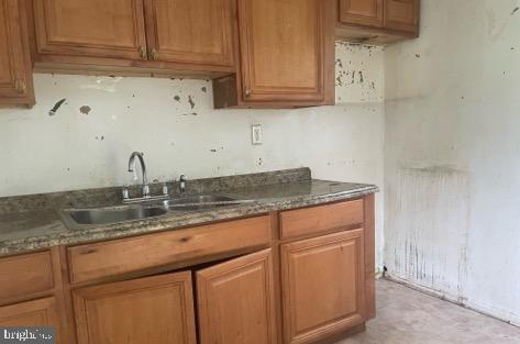 108 Price Road Chester, MD 21619 - Photo 6 of 10 a kitchen with stainless steel appliances granite countertop a sink and cabinets
