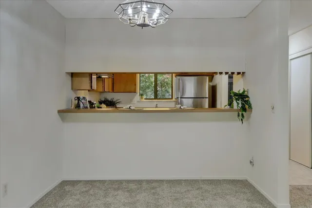 a bathroom with a sink vanity granite toilet and a mirror