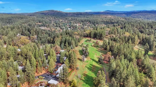 an aerial view of a house with outdoor space