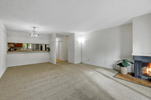 a kitchen with a refrigerator sink stove and cabinets