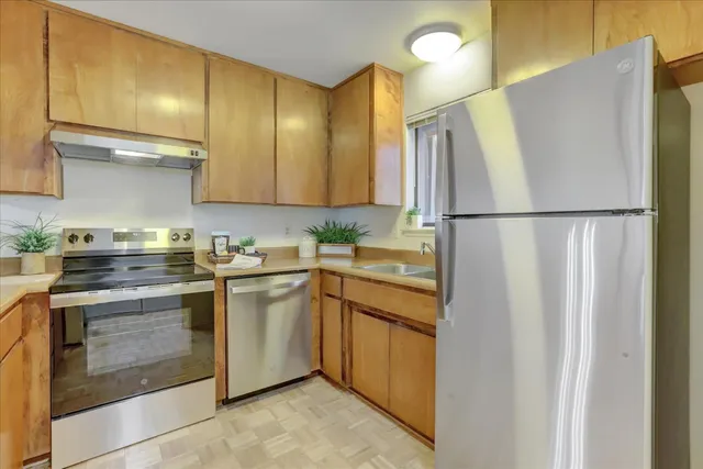 a bedroom with a bed and glass window