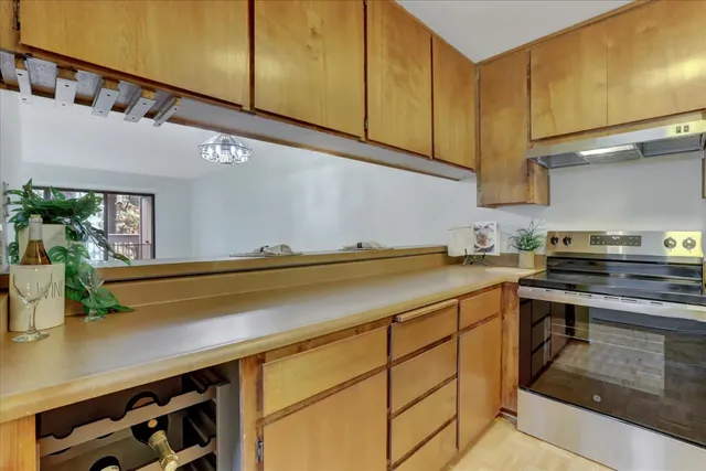 a kitchen with a sink and a refrigerator