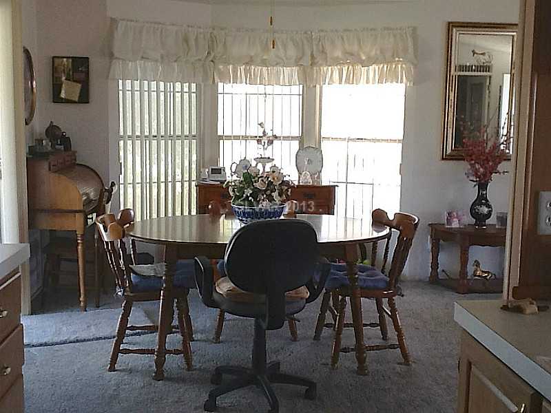 3361 South Blagg Road Pahrump, NV 89048 - Photo 16 of 27 Dining Room. Dining room with bay windows.