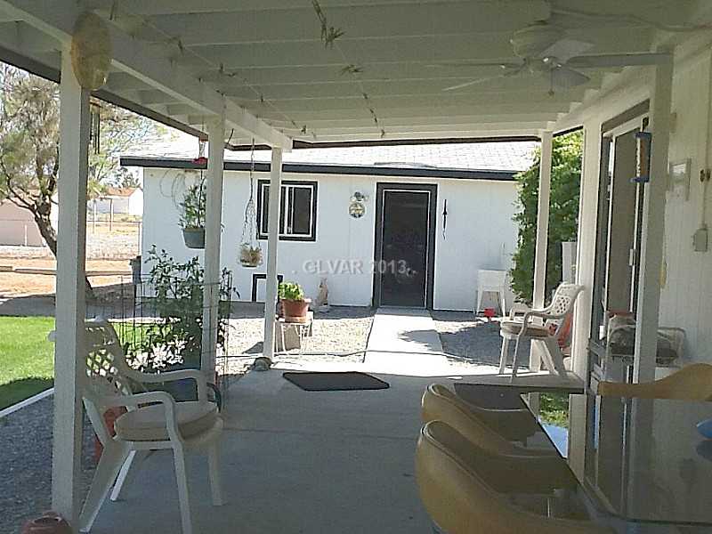 3361 South Blagg Road Pahrump, NV 89048 - Photo 4 of 27 Patio/Deck. Covered back patio has access from the dining room slider and the laundry room.