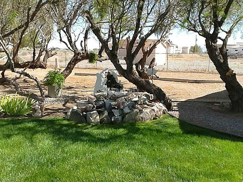 3361 South Blagg Road Pahrump, NV 89048 - Photo 8 of 27 Exterior Back. Back yard water feature