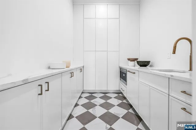 a bathroom with a granite countertop toilet sink and shower
