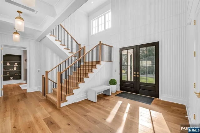 a living room with fireplace furniture and a floor to ceiling window
