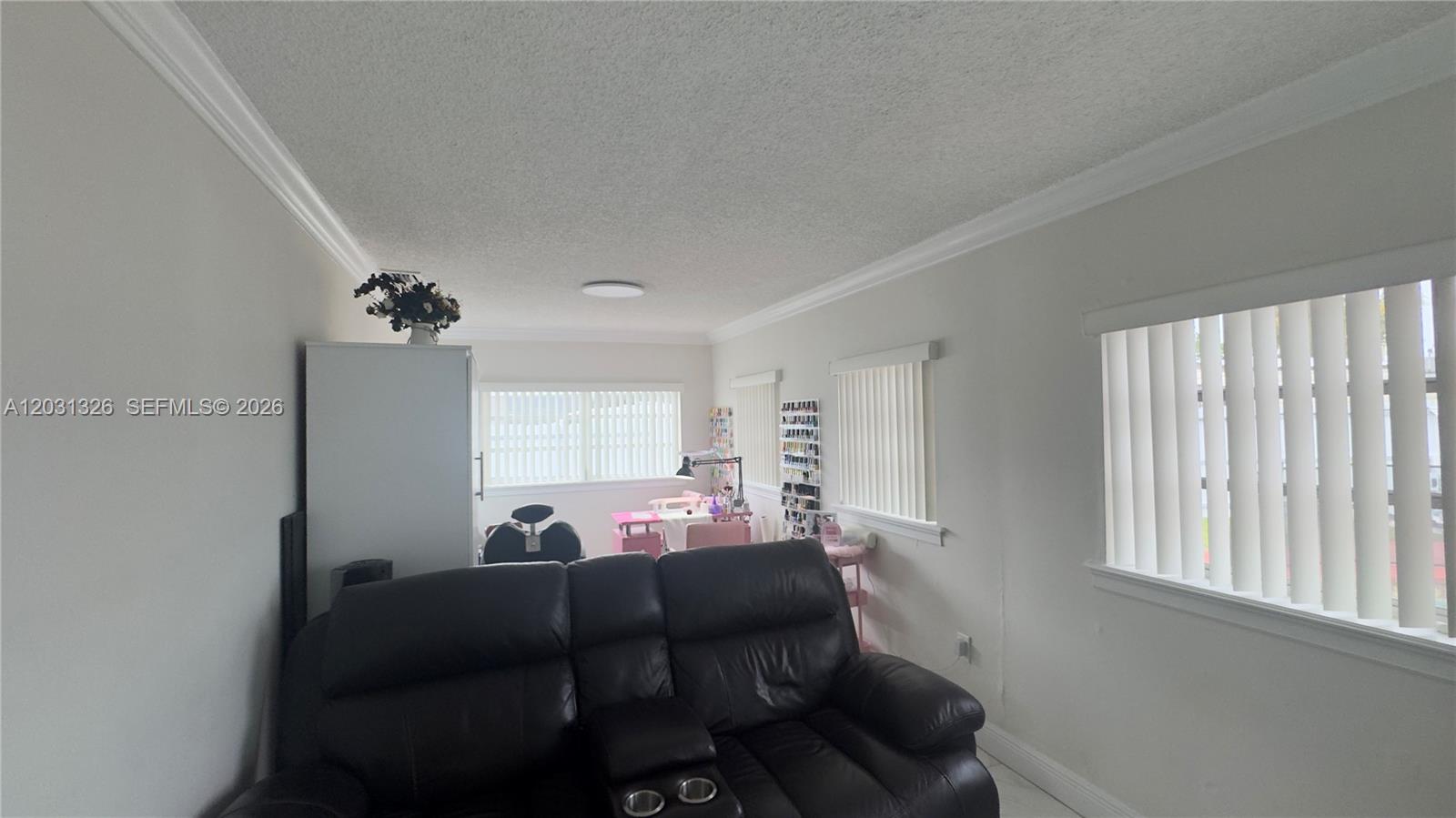12480 Southwest 189th Street Miami, FL 33177 - Photo 16 of 25 a living room with furniture and a window