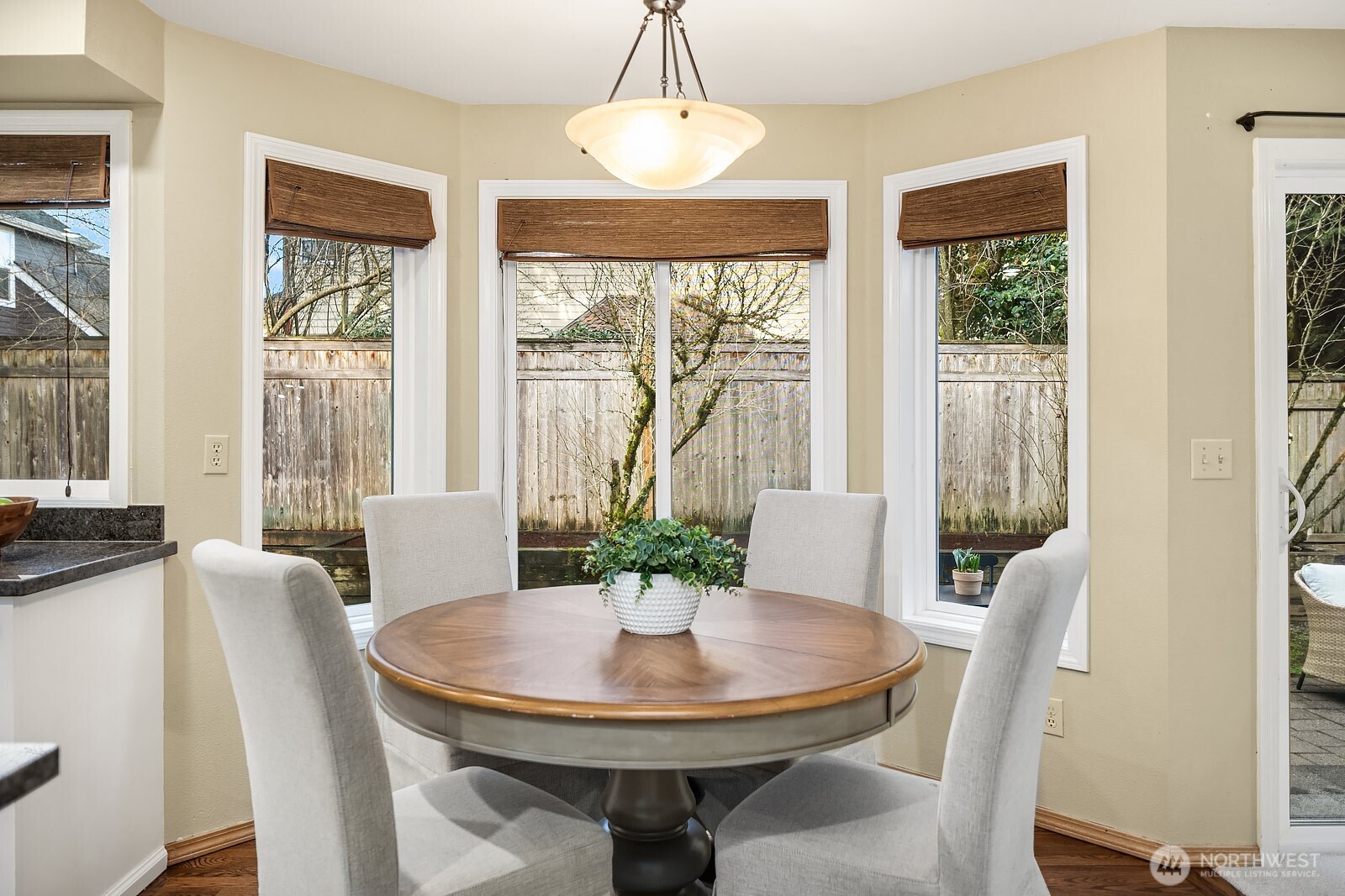 4662 244th Place Southeast Issaquah, WA 98029 - Photo 17 of 40 a view of a dining room with furniture window and wooden floor