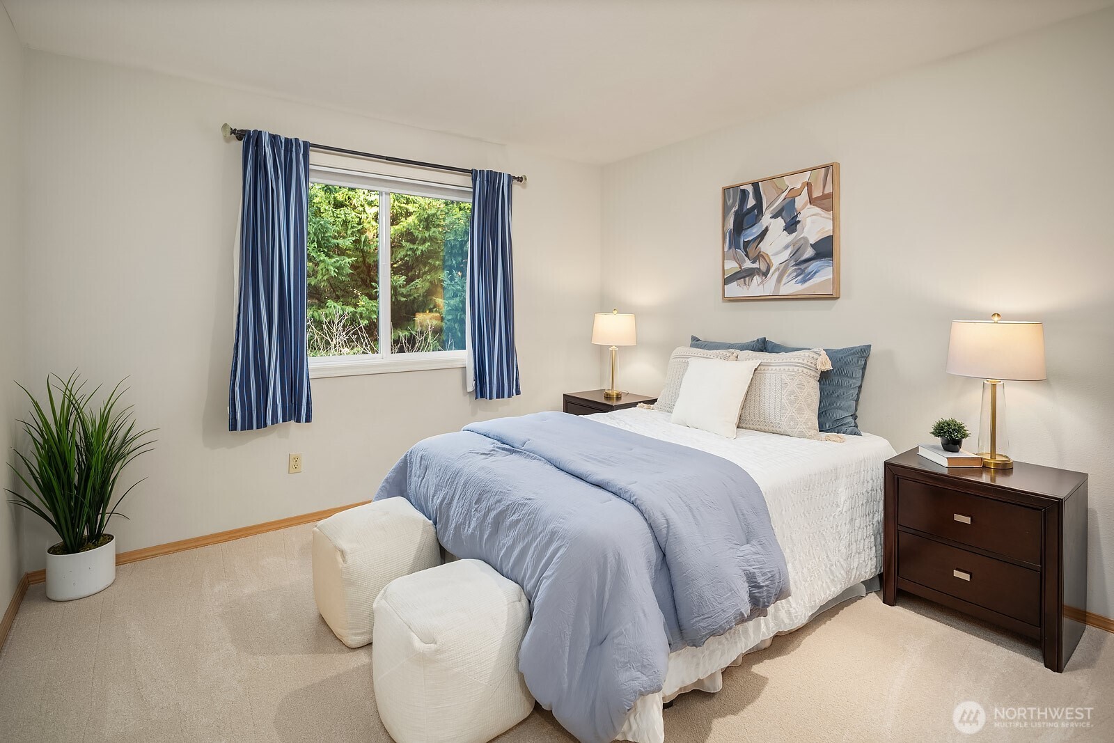 4662 244th Place Southeast Issaquah, WA 98029 - Photo 25 of 40 a bedroom with a bed and a potted plant