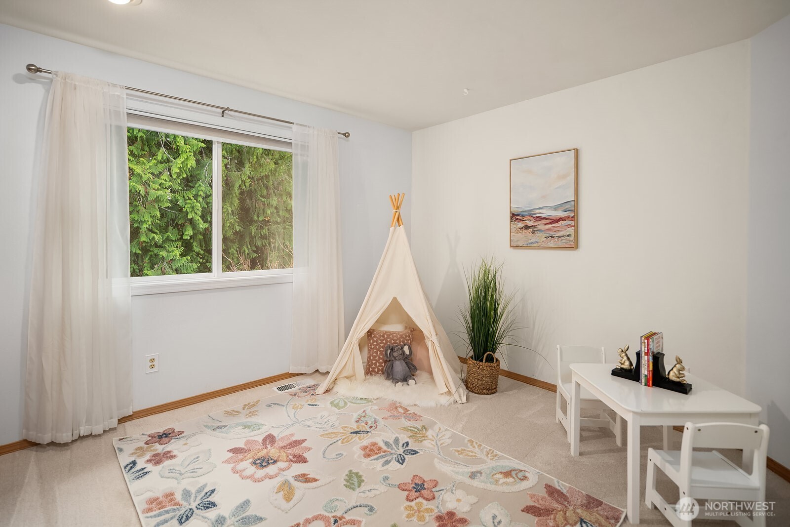 4662 244th Place Southeast Issaquah, WA 98029 - Photo 27 of 40 a view of a bedroom with a bed and wooden floor