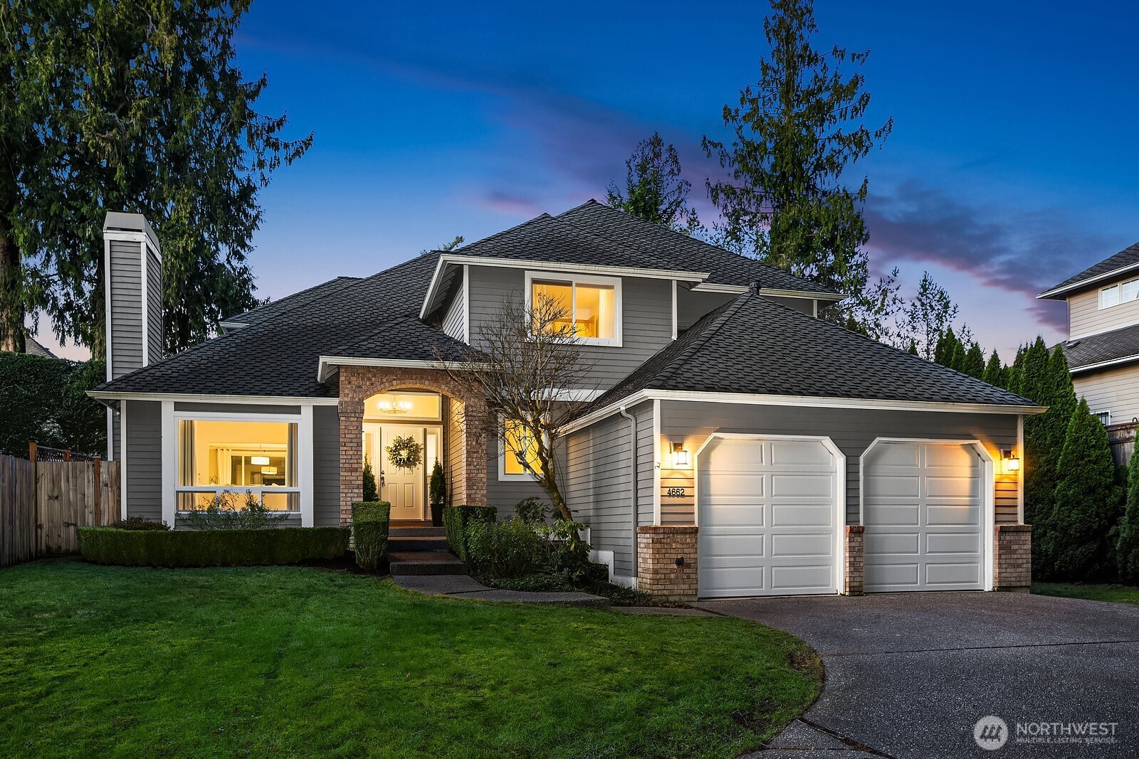 4662 244th Place Southeast Issaquah, WA 98029 - Photo 40 of 40 a front view of a house with yellow lighting