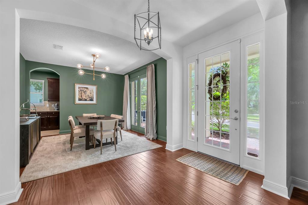 5310 Fishhawk Ridge Drive Lithia, FL 33547 - Photo 5 of 52 a view of a dining room with furniture window and wooden floor