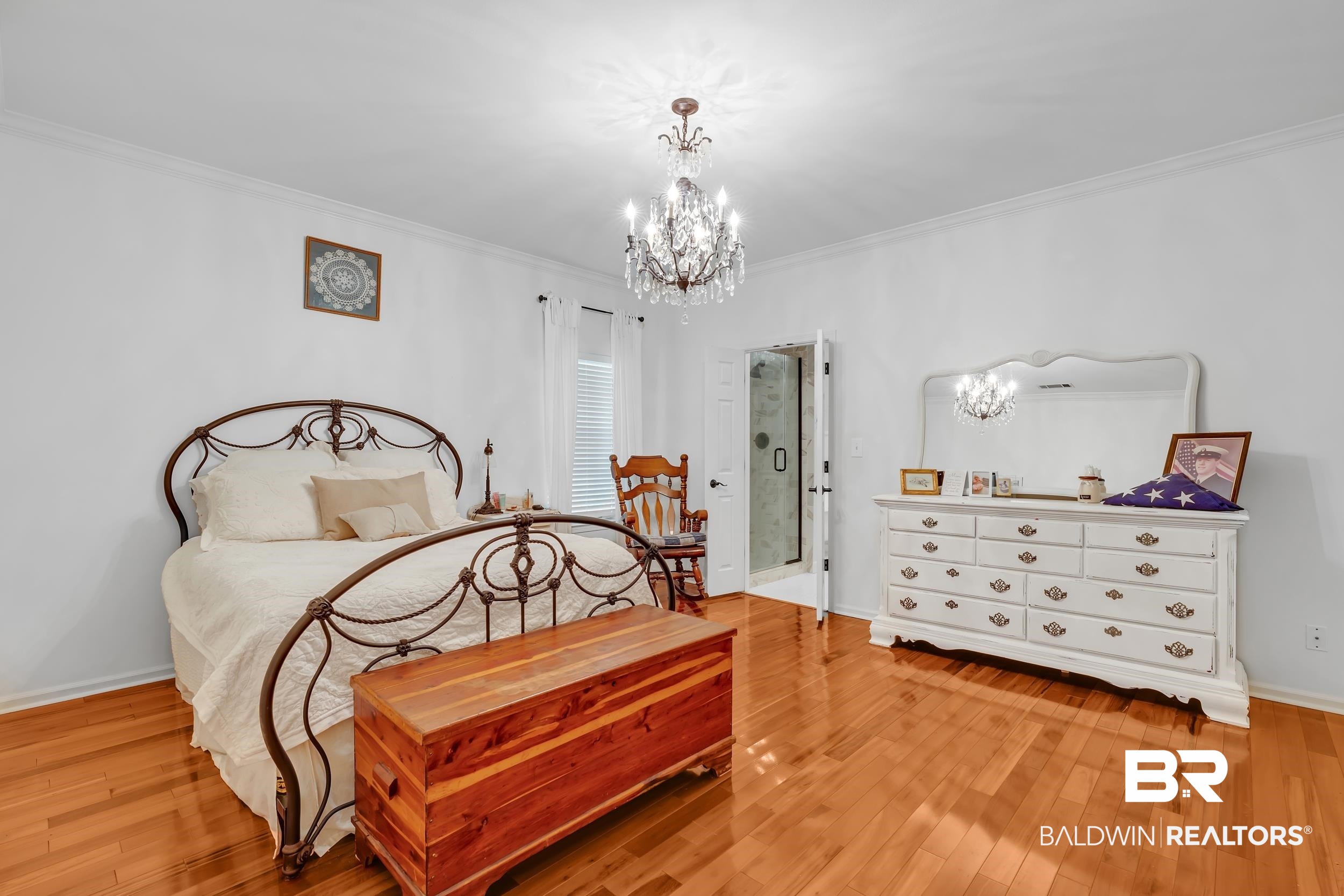 2 Navy Lane Daphne, AL 36527 - Photo 18 of 28 Bedroom featuring a chandelier, light wood finished floors, and ornamental molding