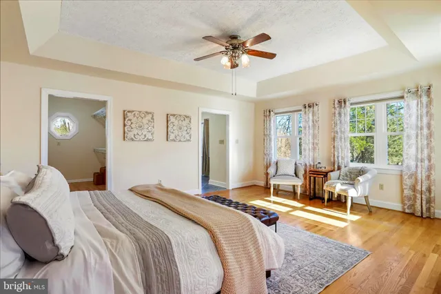 a bathroom with a granite countertop sink mirror and shower