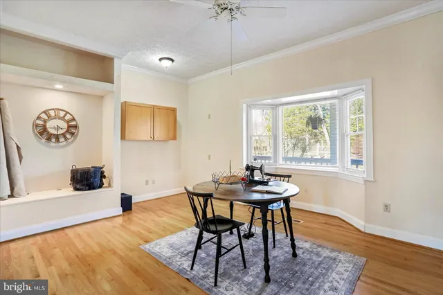 a bedroom with two beds and a dresser