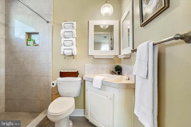 a view of a balcony with wooden floor and fence