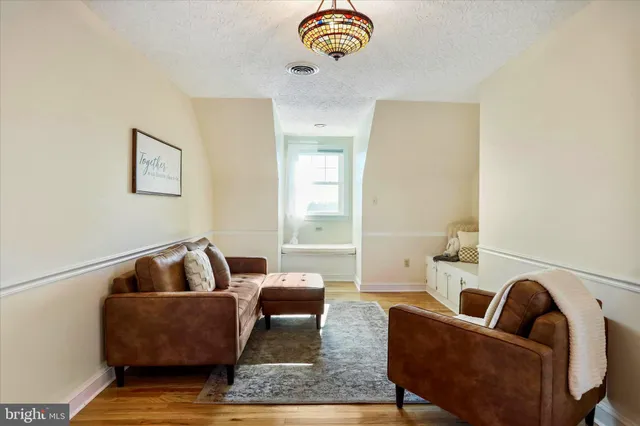 a view of balcony with wooden floor and fence
