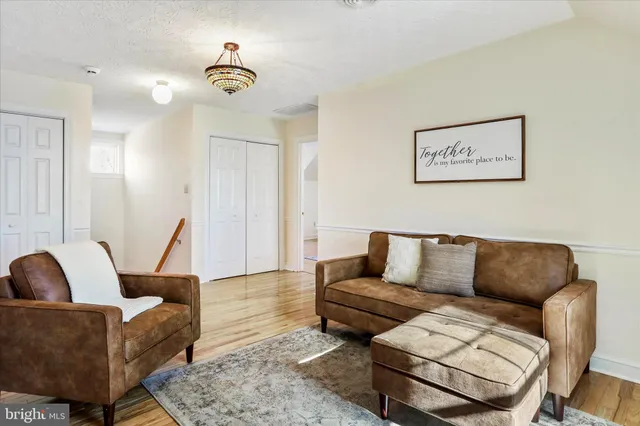a view of balcony with wooden floor and fence