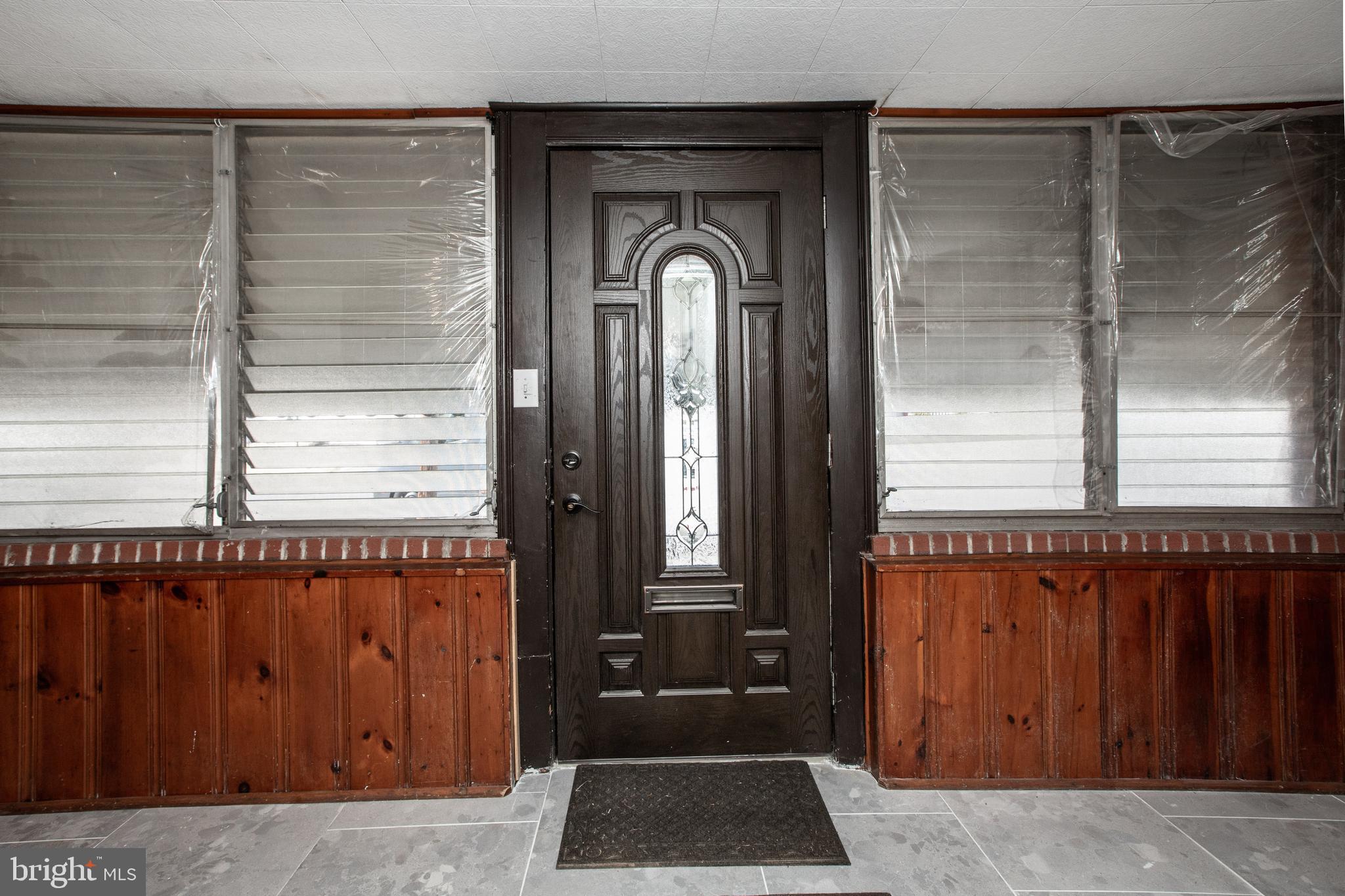 130 Reed Avenue Hamilton, NJ 08610 - Photo 3 of 29 a front view of a house with a door