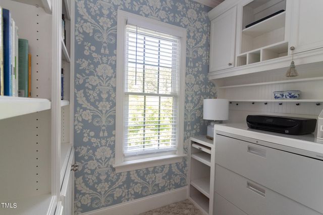 a utility room with sink dryer and washer