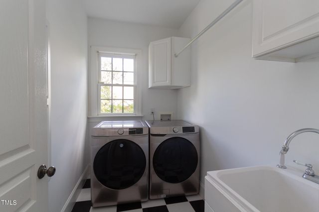 a bedroom with a bed couch and window