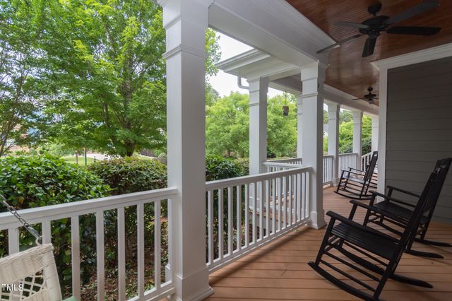 a view of a two chairs in the balcony