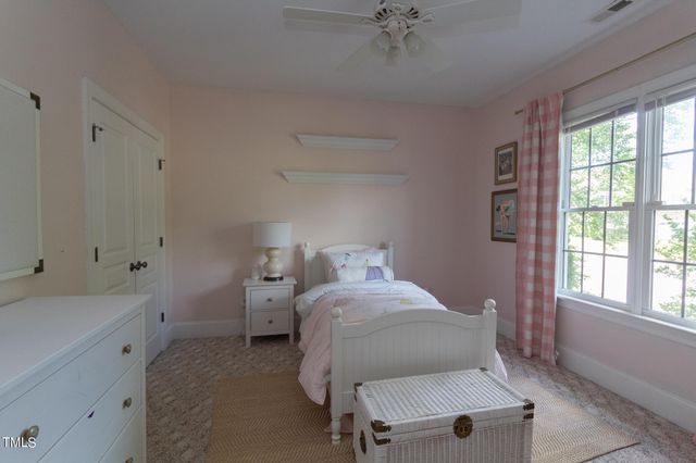 a bathroom with a double vanity sink mirror and a bathtub